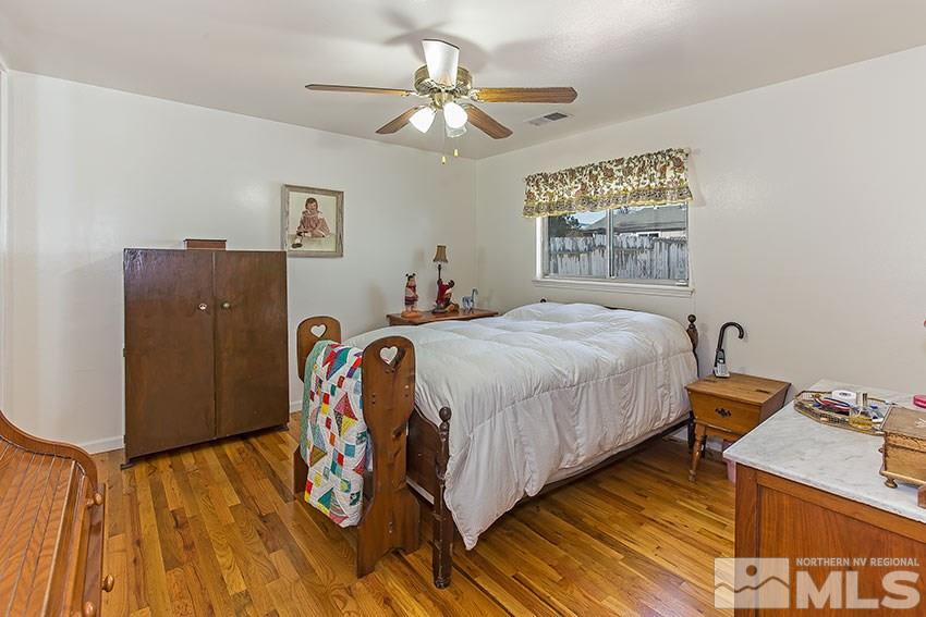 725 Reeves Avenue Reno, NV 89503 - Photo 10 of 15 a bedroom with a bed and a table