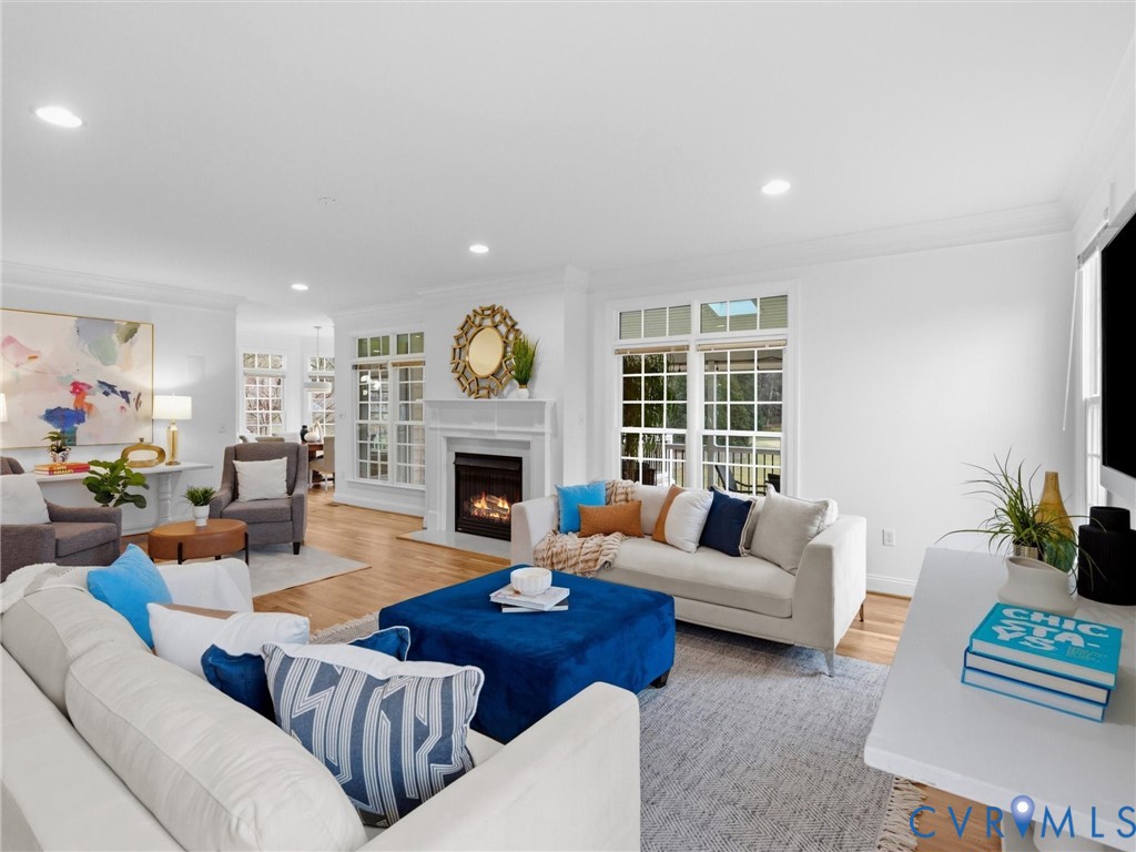 14335 Lander Road Midlothian, VA 23113 - Photo 29 of 70 a living room with furniture a fireplace and a large window