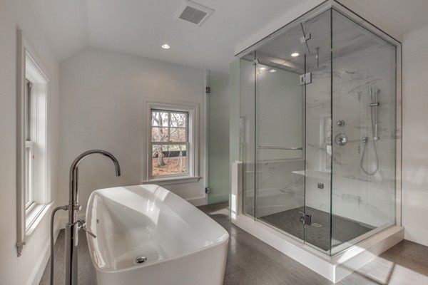 265 Woodland Road Brookline, MA 02467 - Photo 19 of 30 a bathroom with a shower and a bathtub