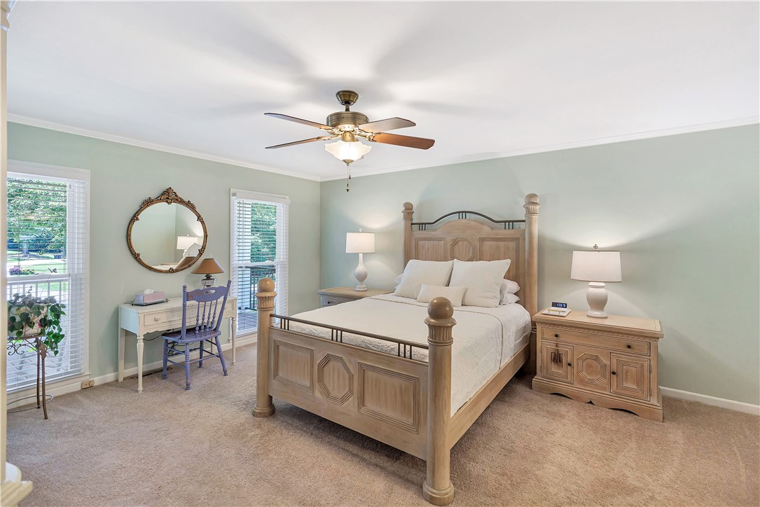 910 Chantilly Lane Anderson, SC 29625 - Photo 10 of 38 The tranquil bedroom offers ample natural light through its windows and a welcoming ceiling fan for comfort.