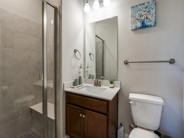 a living room with furniture a rug and a chandelier