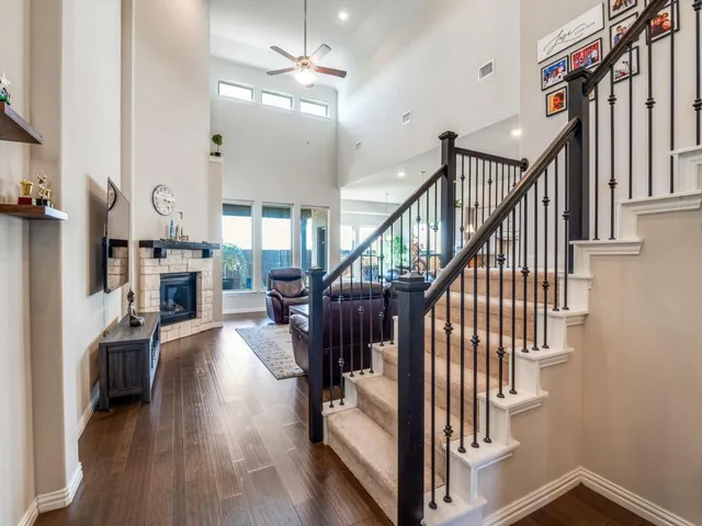 a view of entryway and hall with wooden floor