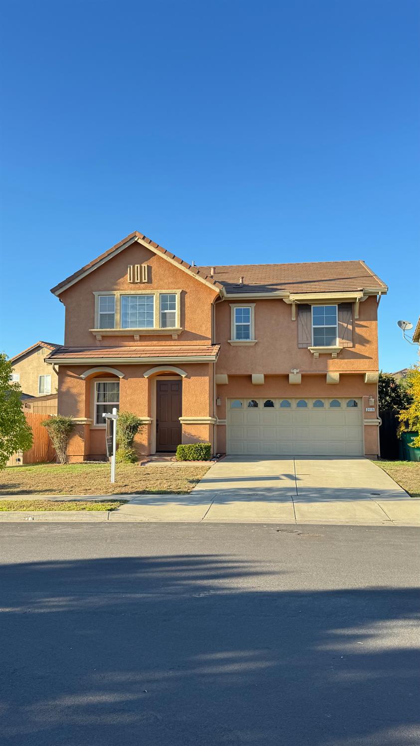 2119 Bennets Mill Way Stockton, CA 95212 - Photo 1 of 1 a front view of a house with a yard