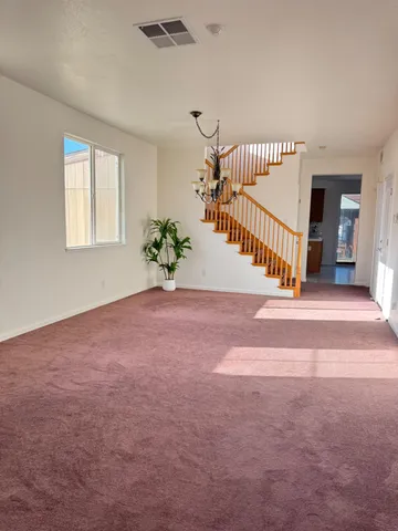 a view of entryway and hall with a window
