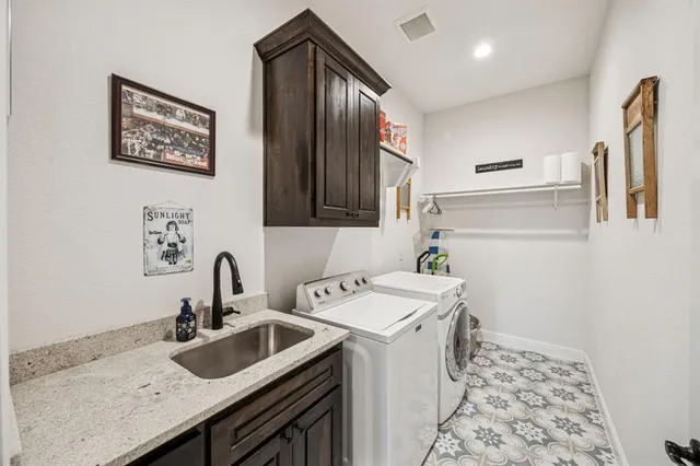 a view of kitchen with sink microwave and refrigerator