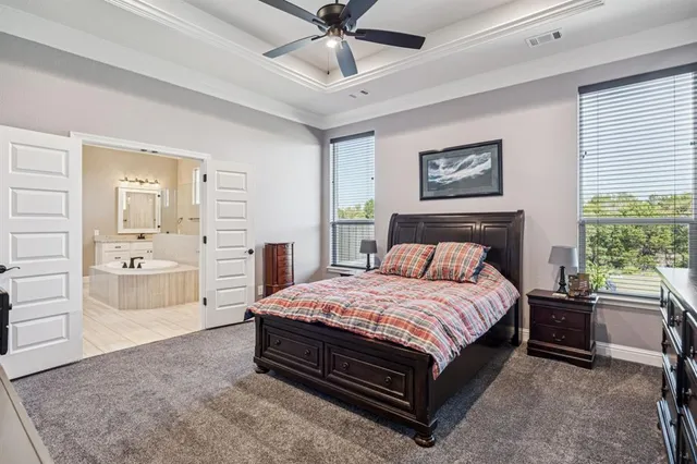 a bathroom with a granite countertop sink and a toilet