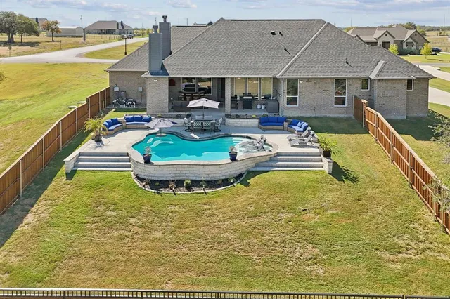 a view of a swimming pool with a patio