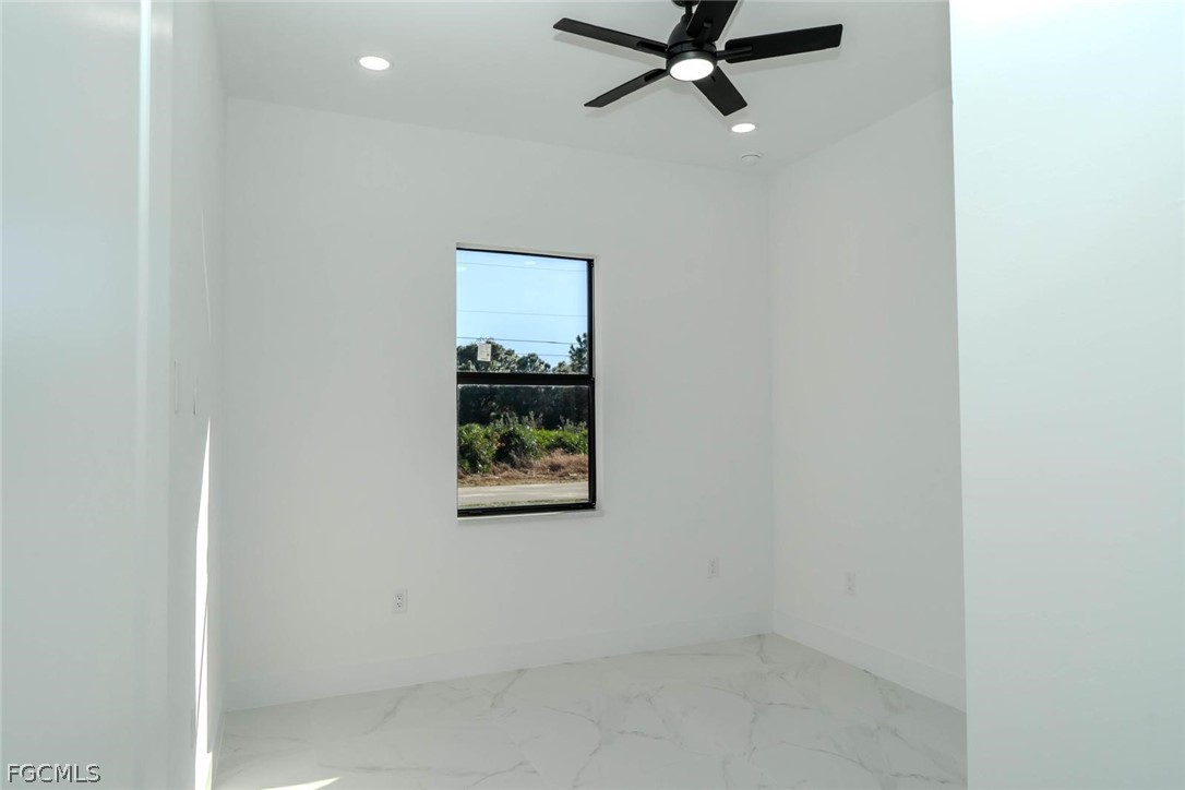 3206 14th Street Southwest Lehigh Acres, FL 33976 - Photo 14 of 38 an empty room with windows