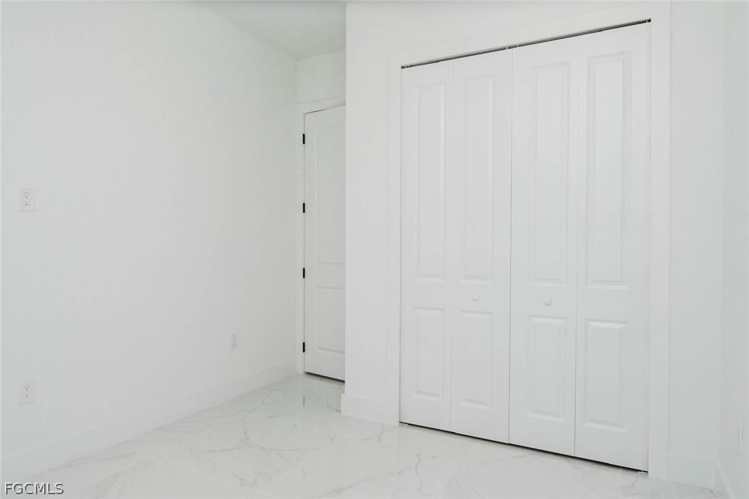 3206 14th Street Southwest Lehigh Acres, FL 33976 - Photo 18 of 38 a view of an empty room