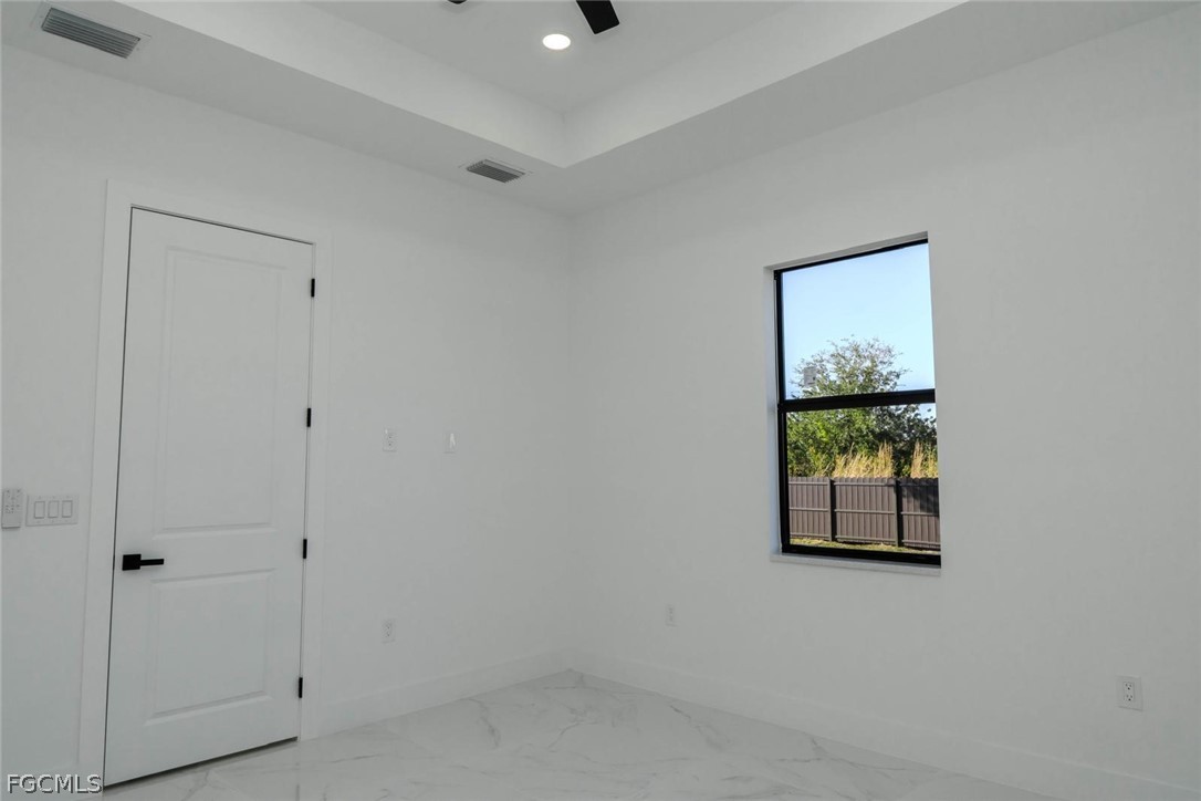3206 14th Street Southwest Lehigh Acres, FL 33976 - Photo 20 of 38 a view of an empty room with a window