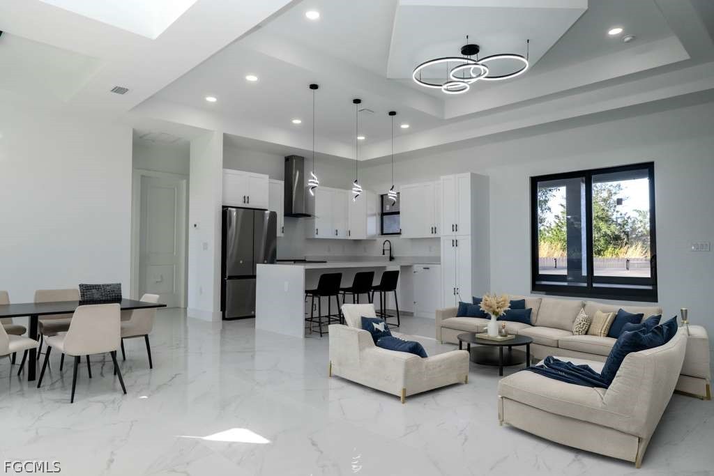 3206 14th Street Southwest Lehigh Acres, FL 33976 - Photo 36 of 38 a living room with furniture and kitchen view