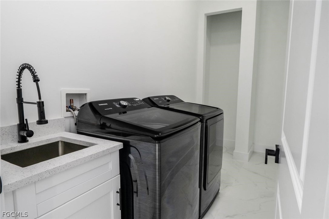 3206 14th Street Southwest Lehigh Acres, FL 33976 - Photo 6 of 38 a utility room with dryer and washer