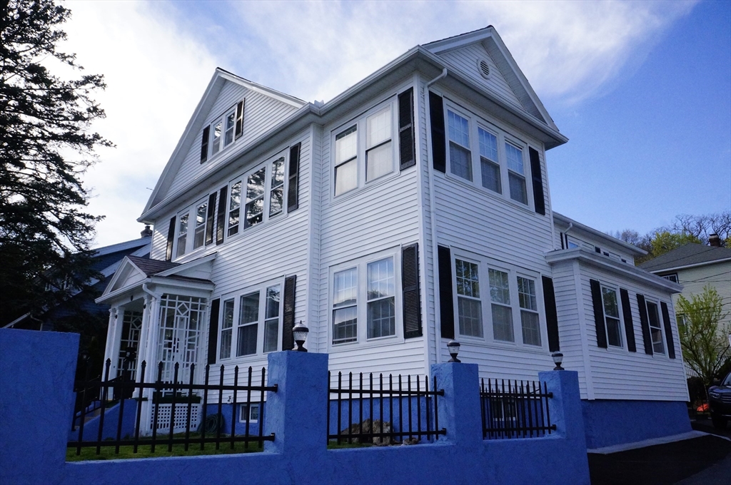 a view of a house with a roof deck