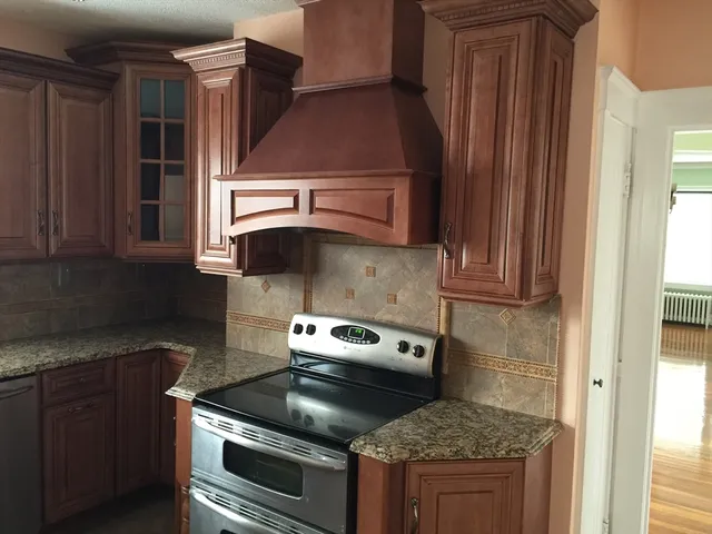 a kitchen with a stove and a microwave