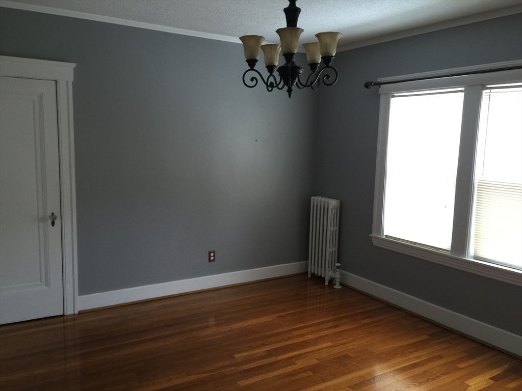 128 Institute Road, Unit 2 Worcester, MA 01602 - Photo 5 of 9 a view of empty room with wooden floor