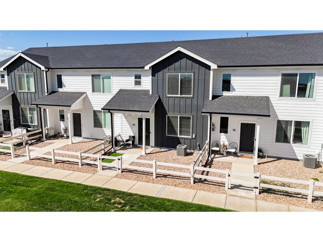260 Pawnee Road, Unit D3 Ault, CO 80610 - Photo 35 of 44 Front aerial view with green space.