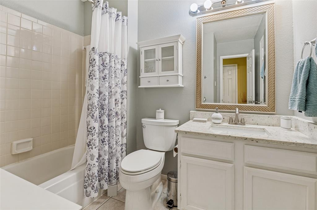 22 Abbey Road Euless, TX 76039 - Photo 15 of 23 Full bathroom, located on the second floor. Includes built in cabinets and storage, decorative mirror, vanity with granite vanity.