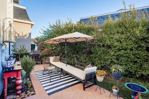 swimming pool view with a seating space
