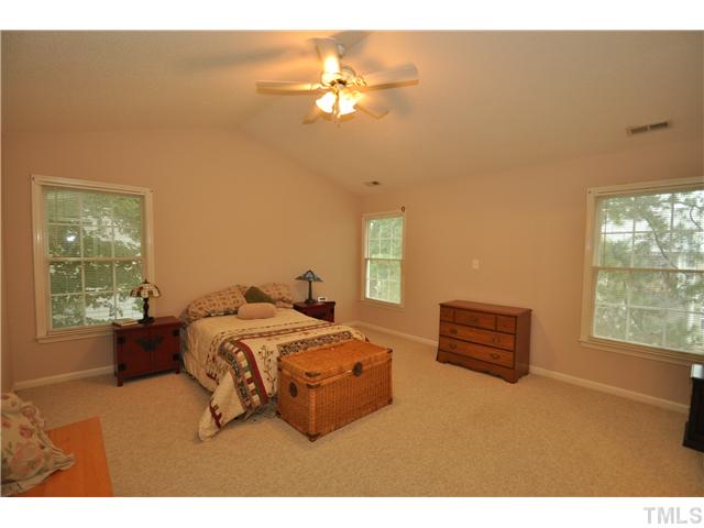 9008 Breeland Way Raleigh, NC 27613 - Photo 11 of 18 Spacious room with cathedral ceiling and adjacent private bath