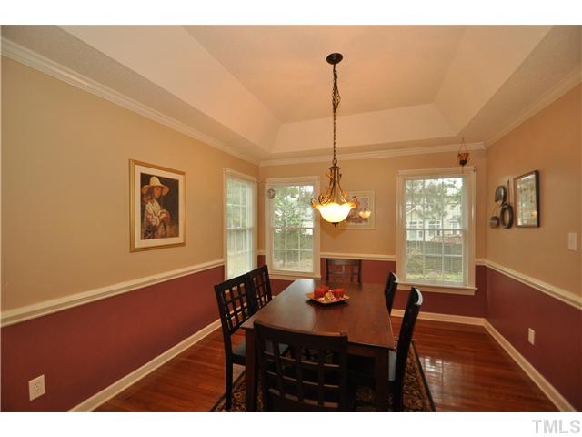 9008 Breeland Way Raleigh, NC 27613 - Photo 4 of 18 Formal dining room has trey cieling, hardwood floor and 2 built-in china cabinets