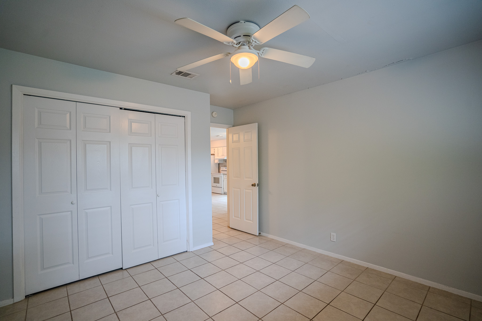 12403 Tree Line Drive, Unit B Austin, TX 78729 - Photo 13 of 16 wooden floor in an empty room