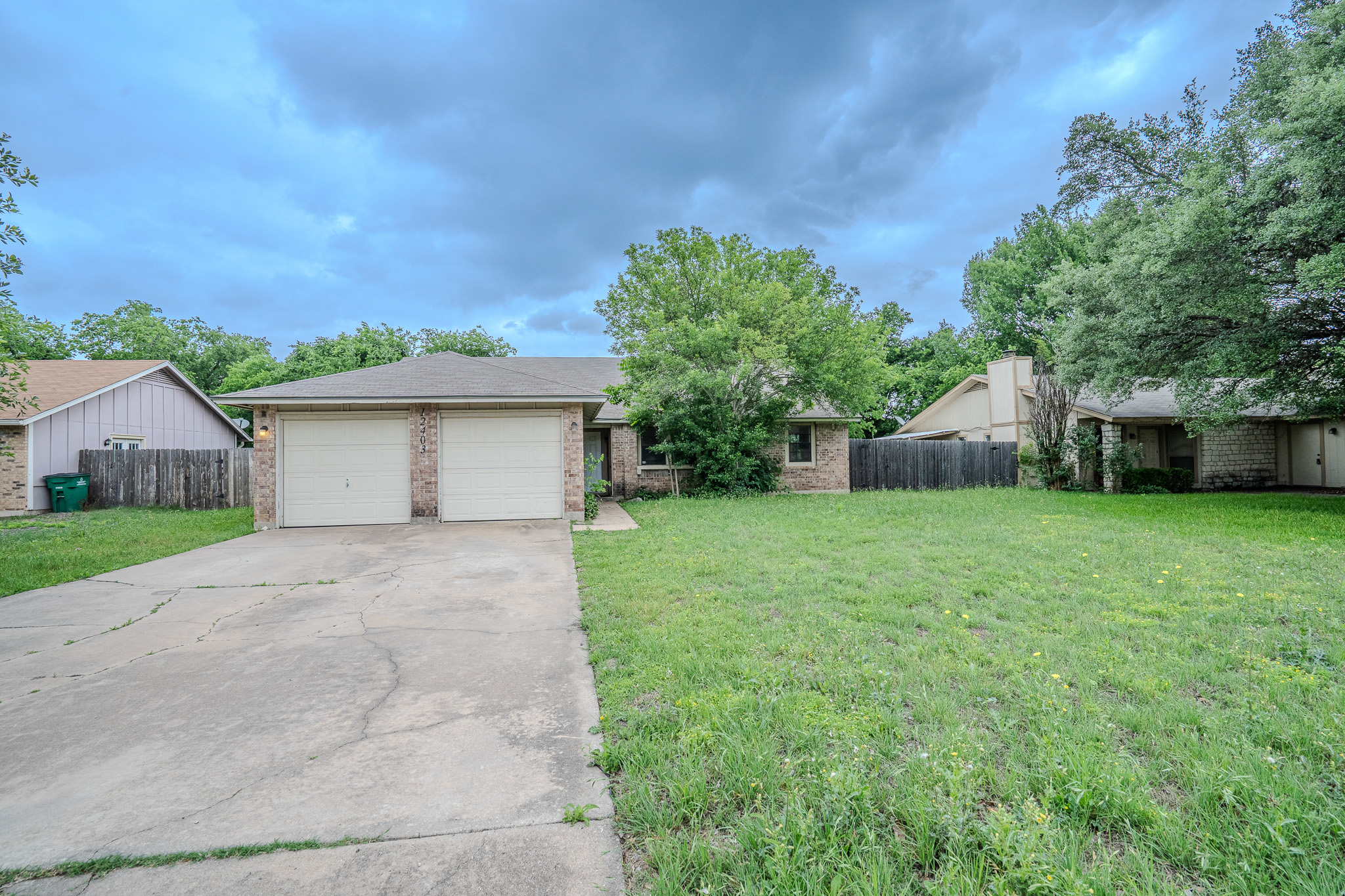 12403 Tree Line Drive, Unit B Austin, TX 78729 - Photo 2 of 16 a view of a house with backyard and a tree