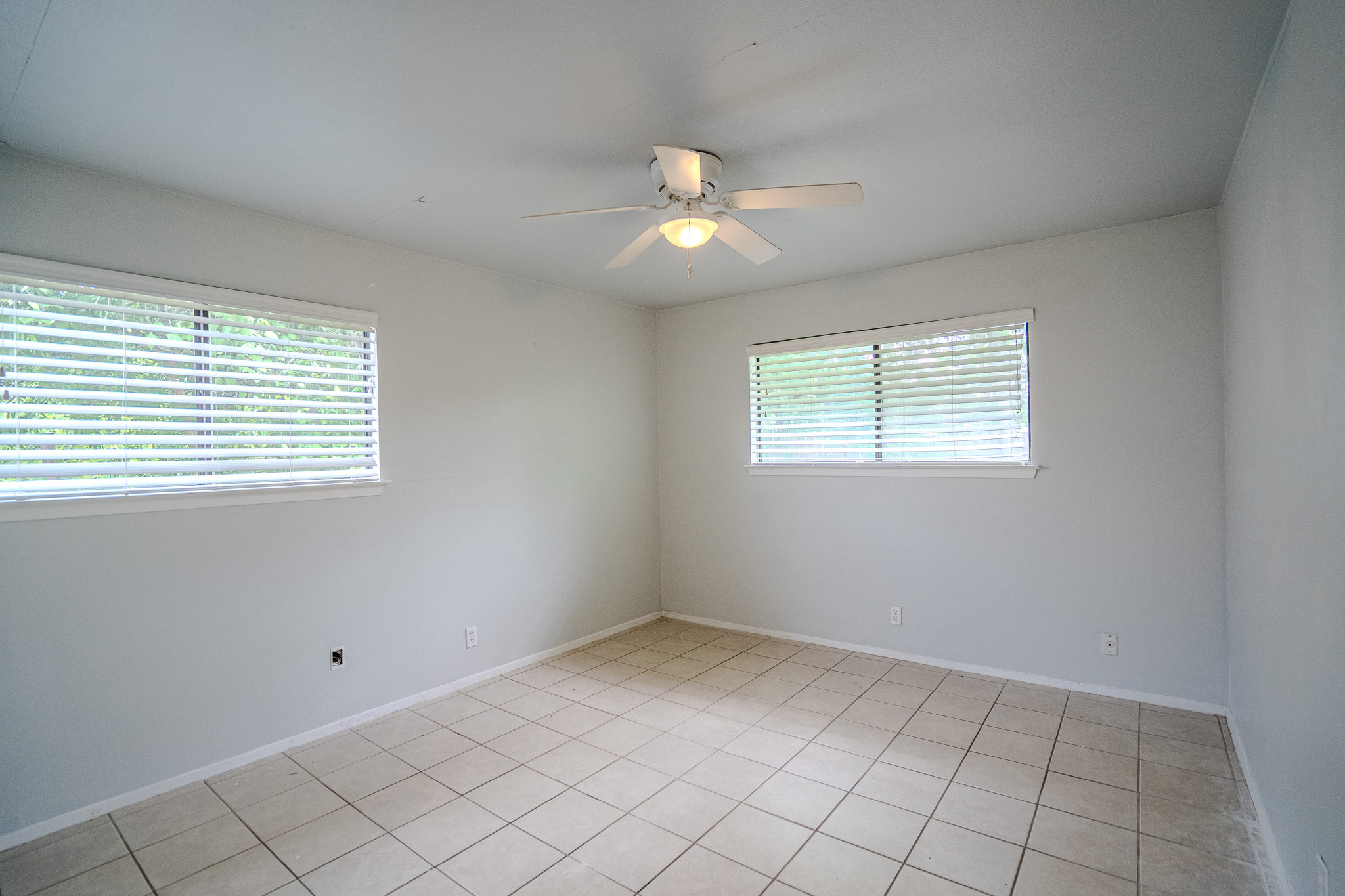 12403 Tree Line Drive, Unit B Austin, TX 78729 - Photo 9 of 16 a view of an empty room with a window