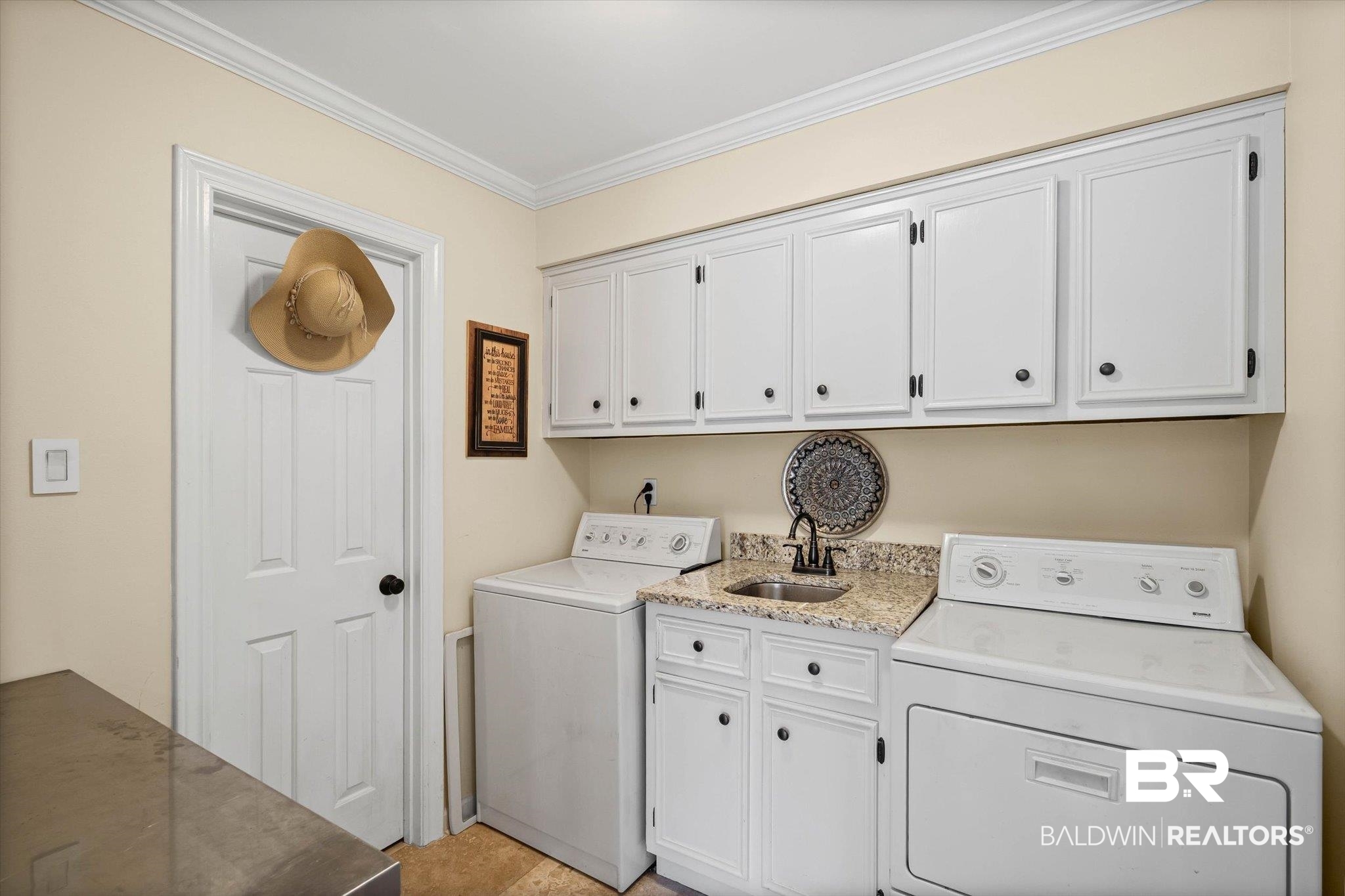 1517 Ridgeland Road East Mobile, AL 36695 - Photo 18 of 39 Washroom featuring independent washer and dryer, cabinet space, and ornamental molding