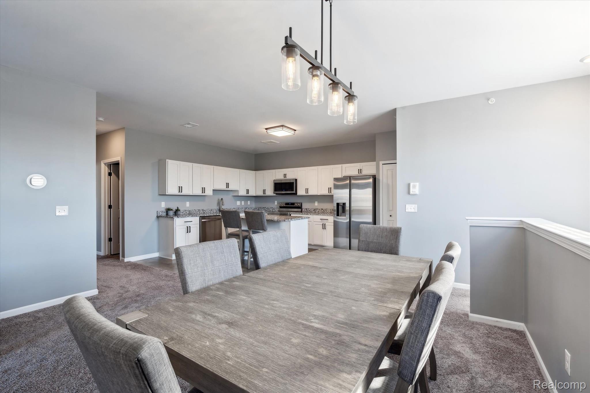 9930 Ridge Run Street Howell, MI 48855 - Photo 7 of 19 Dining room open to kitchen.