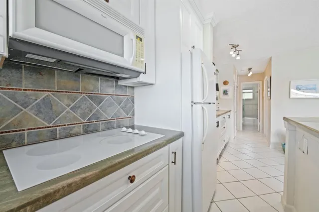 a view of kitchen island with cabinets