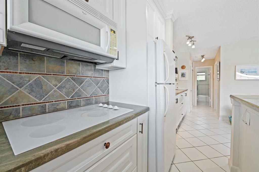 701 South Riverside Drive, Unit 107 Pompano Beach, FL 33062 - Photo 16 of 27 a view of kitchen island with cabinets