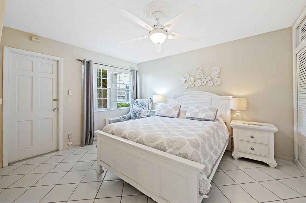 701 South Riverside Drive, Unit 107 Pompano Beach, FL 33062 - Photo 18 of 27 a spacious bedroom with a bed and a window