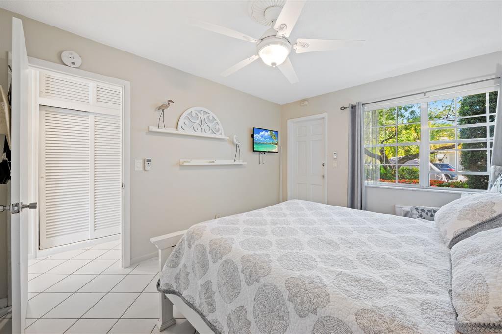 701 South Riverside Drive, Unit 107 Pompano Beach, FL 33062 - Photo 20 of 27 a bedroom with a bed and a window