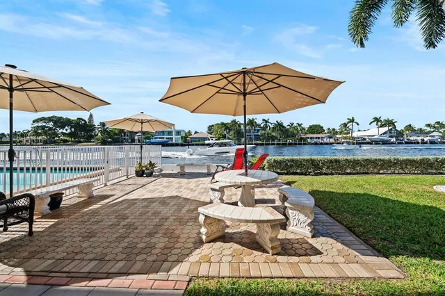 a view of a swimming pool with a patio