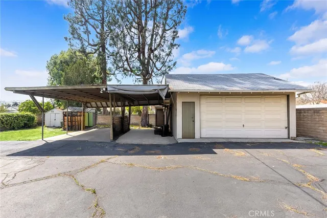 a view of a house with a yard and garage