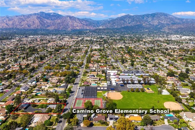 an aerial view of residential house and outdoor space