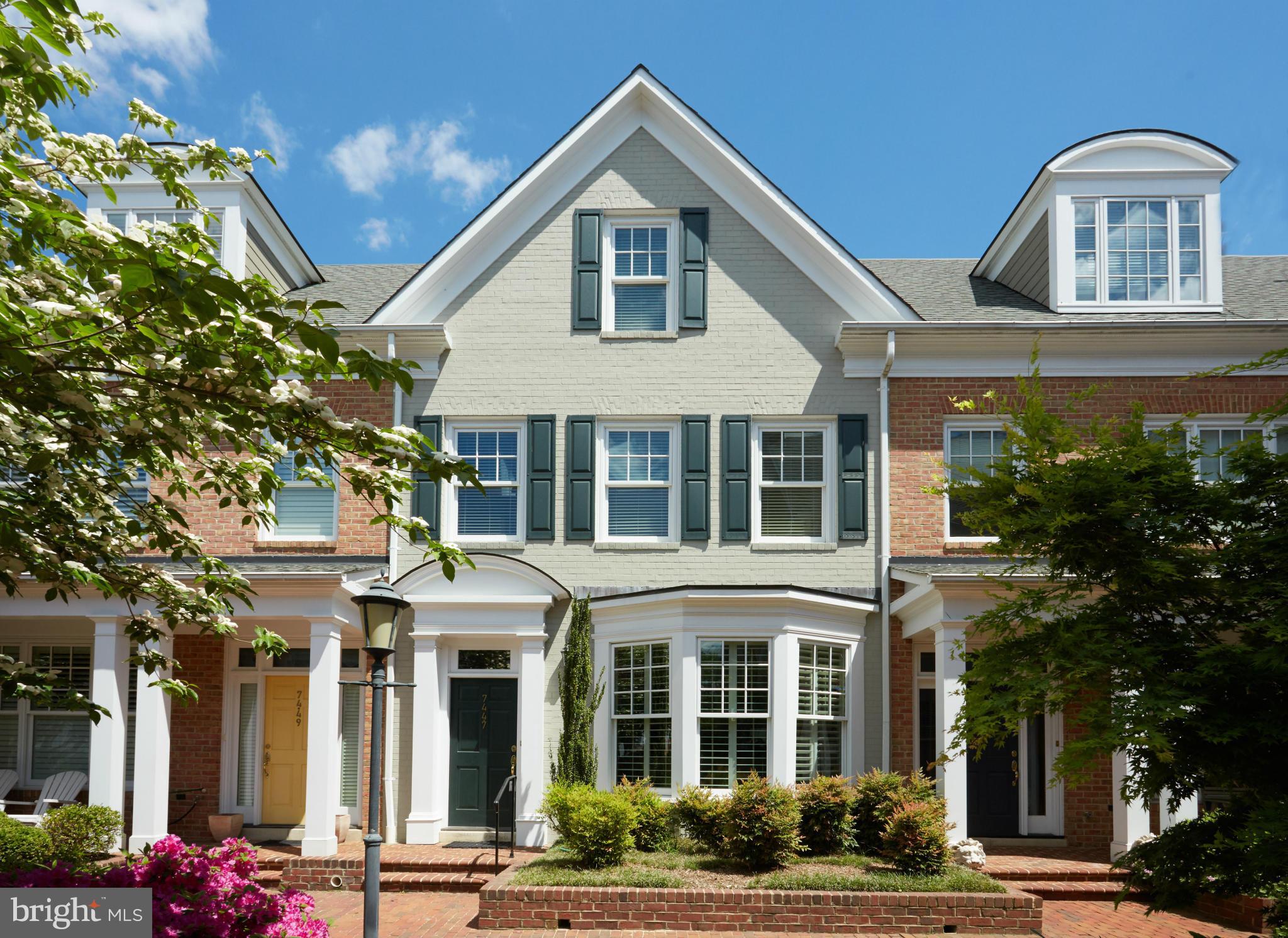 7447 Arlington Road Bethesda, MD 20814 - Photo 1 of 20 a front view of a residential apartment building with a yard