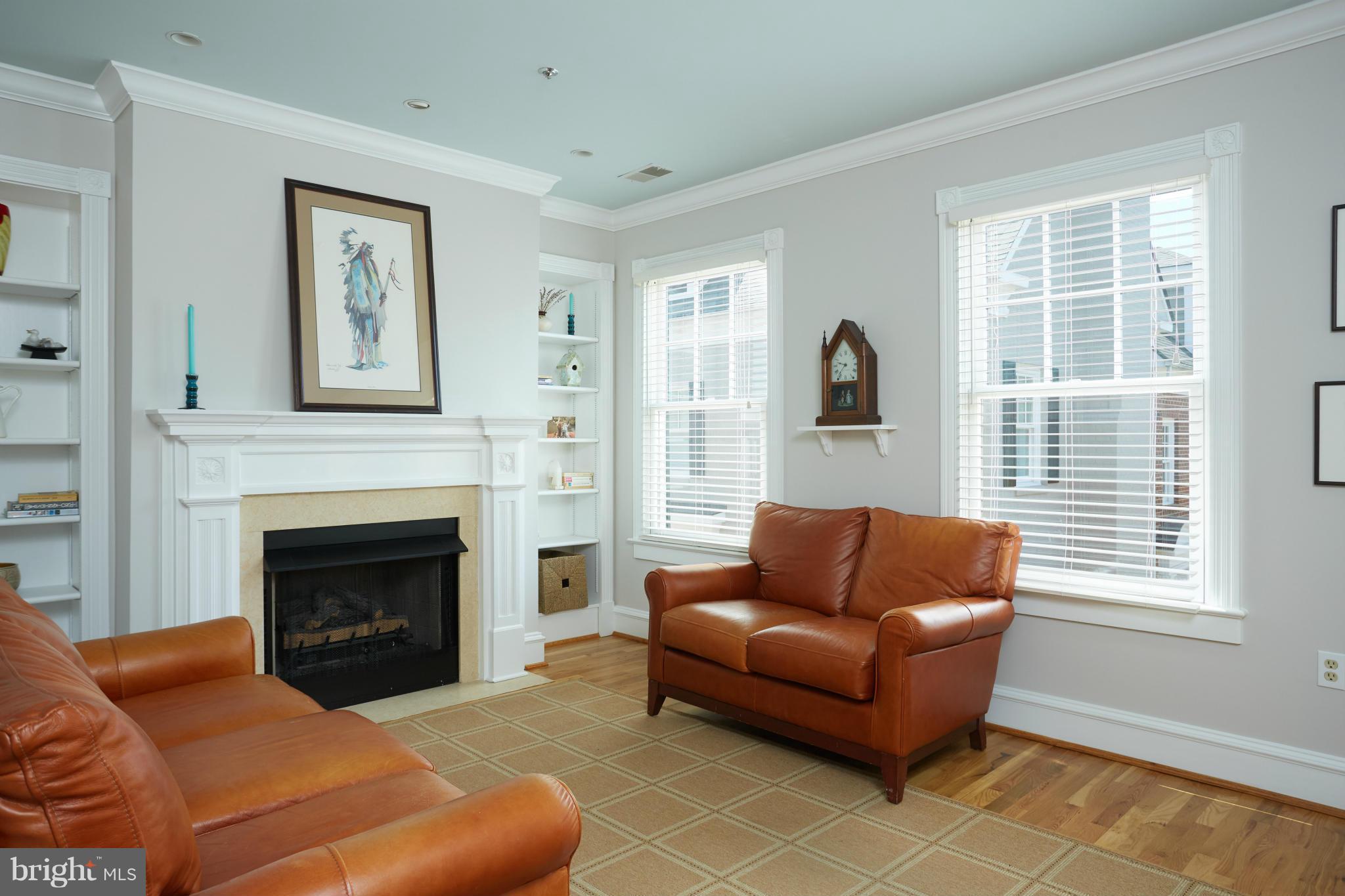 7447 Arlington Road Bethesda, MD 20814 - Photo 15 of 20 a living room with furniture window and fireplace