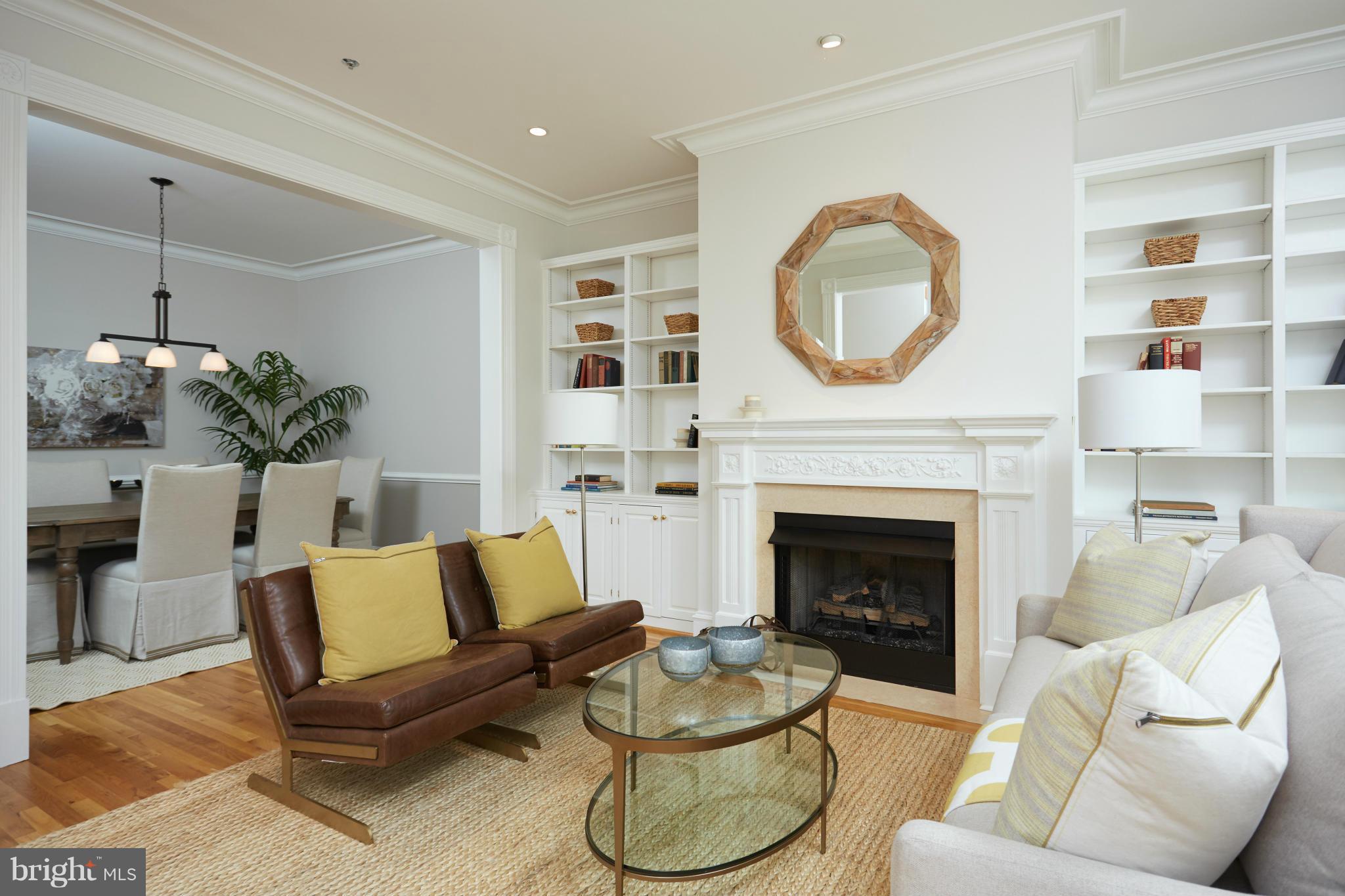 7447 Arlington Road Bethesda, MD 20814 - Photo 4 of 20 a living room with furniture and a fireplace