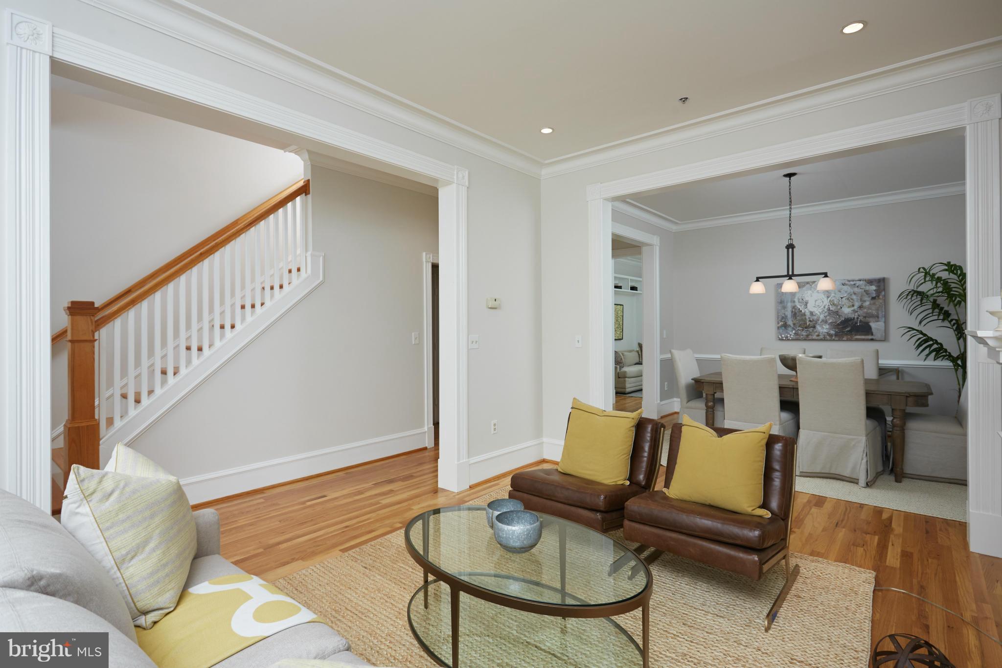 7447 Arlington Road Bethesda, MD 20814 - Photo 5 of 20 a living room with furniture and a dining table