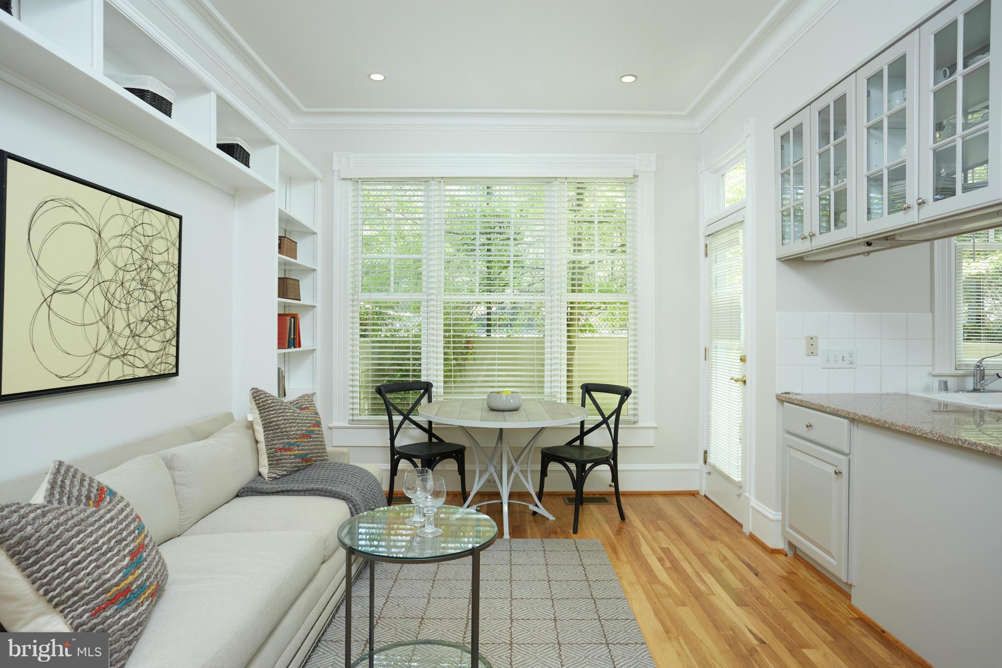 7447 Arlington Road Bethesda, MD 20814 - Photo 9 of 20 a view of a dining room with furniture window and outside view