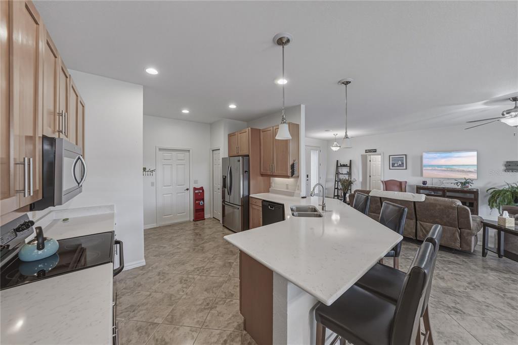 4489 Strathmore Drive Lake Wales, FL 33859 - Photo 19 of 89 a large kitchen with a table and chairs
