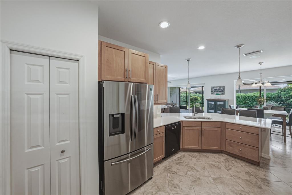 4489 Strathmore Drive Lake Wales, FL 33859 - Photo 25 of 89 a kitchen with a refrigerator sink and cabinets