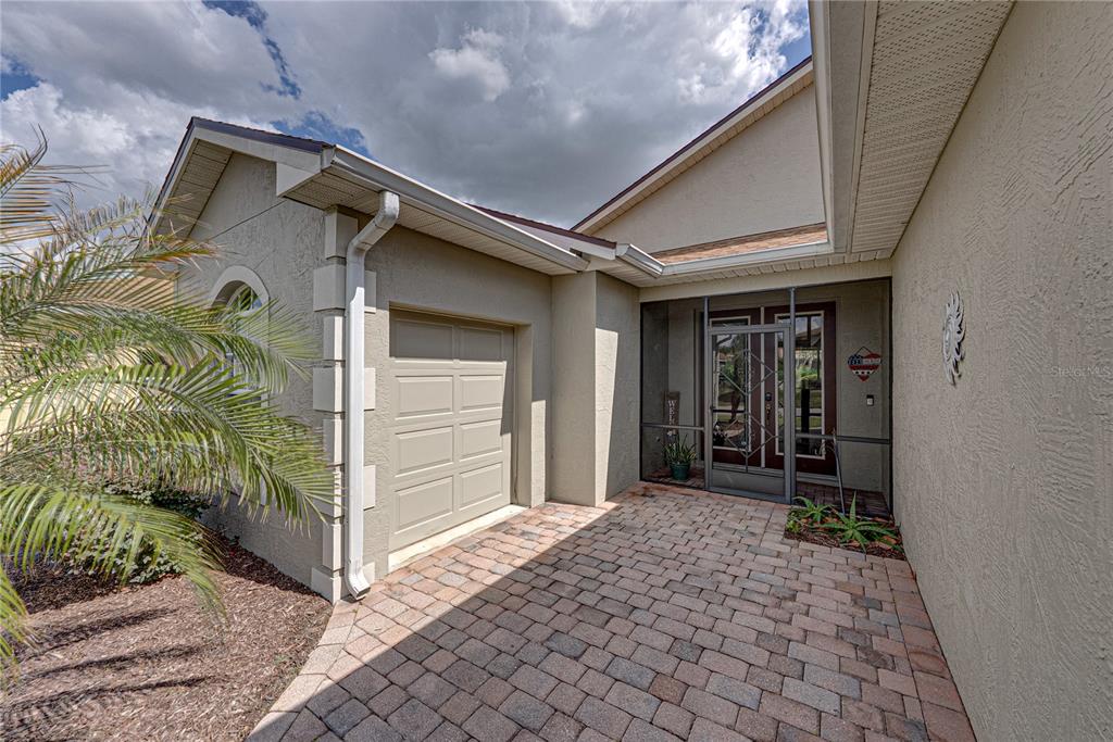 4489 Strathmore Drive Lake Wales, FL 33859 - Photo 3 of 89 a front view of a house with a yard