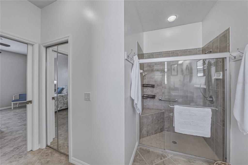 4489 Strathmore Drive Lake Wales, FL 33859 - Photo 34 of 89 a bathroom with a shower and a sink