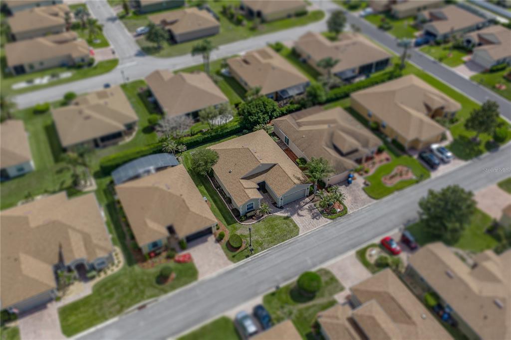 4489 Strathmore Drive Lake Wales, FL 33859 - Photo 59 of 89 an aerial view of a house with a garden