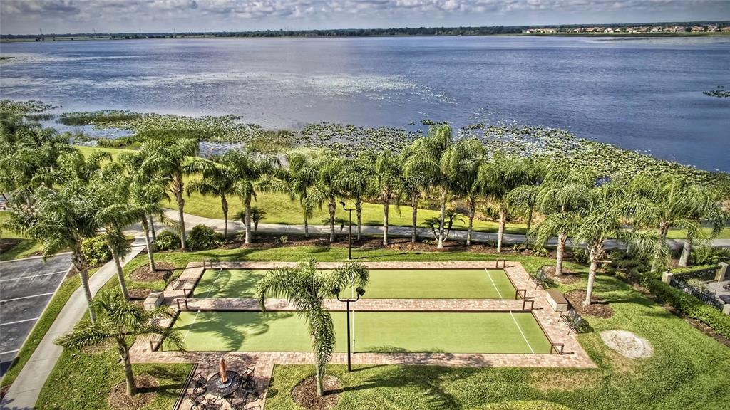 4489 Strathmore Drive Lake Wales, FL 33859 - Photo 77 of 89 a view of a swimming pool with a yard