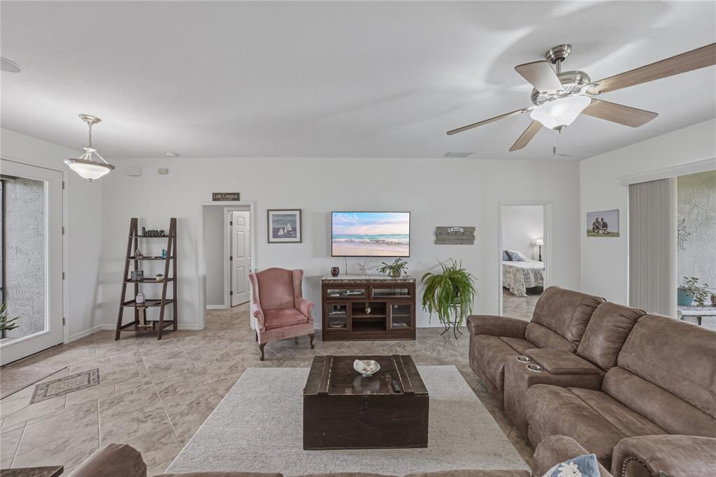 4489 Strathmore Drive Lake Wales, FL 33859 - Photo 10 of 89 a living room with furniture and wooden floor