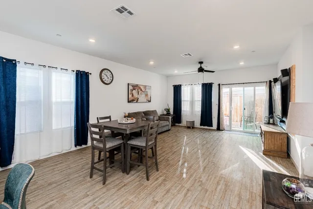 a view of a dining room with furniture and a table