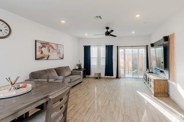 a view of a dining room with furniture and window